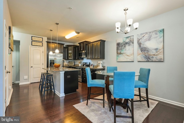 9423 Geaton Park Pl, Lanham, MD 20706 - dining room with a chandelier and dark wood-type flooring