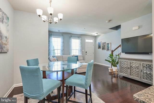 9423 Geaton Park Pl, Lanham, MD 20706 - dining space featuring wood finished floors, a chandelier, and stairway