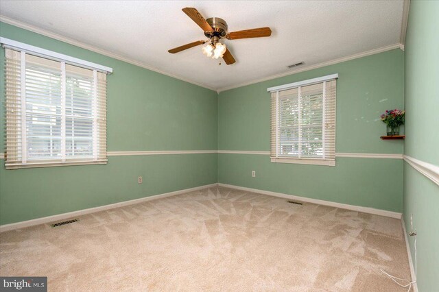 16102 Philmont Ln, Bowie, MD 20716 - carpeted spare room with plenty of natural light, ornamental molding, and a ceiling fan