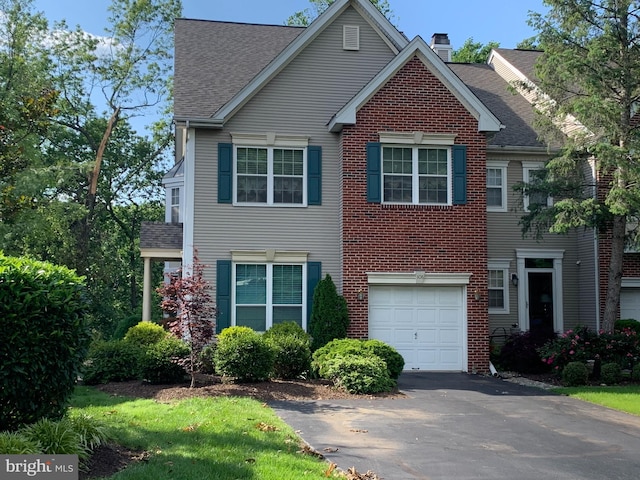 108 Lemonton Way, Wayne, PA 19087 - view of front facade featuring asphalt driveway, roof with shingles, a chimney, an attached garage, and brick siding