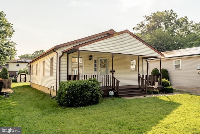 361 Crawford Ave, Maple Shade, NJ 08052 - view of front of home with a shed, a front lawn, and a porch