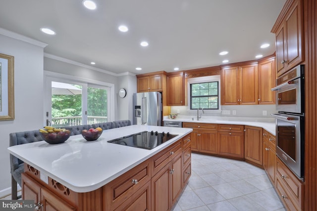 553 Choptank Cove Ct, Annapolis, MD 21401 - kitchen featuring appliances with stainless steel finishes, crown molding, light countertops, recessed lighting, and brown cabinets