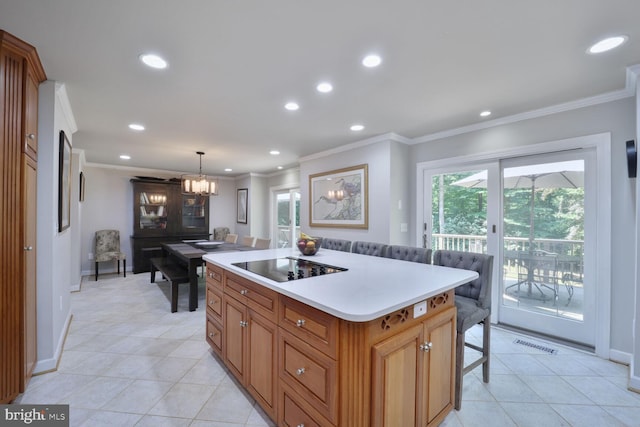 553 Choptank Cove Ct, Annapolis, MD 21401 - kitchen with black electric stovetop, crown molding, a chandelier, light tile patterned floors, and light countertops