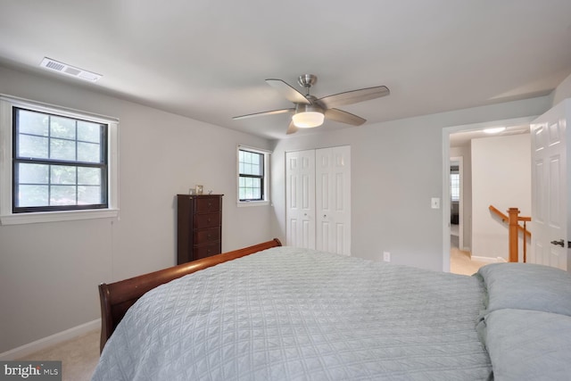 553 Choptank Cove Ct, Annapolis, MD 21401 - bedroom with a closet, light carpet, and a ceiling fan
