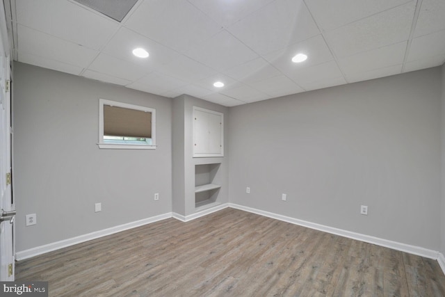 553 Choptank Cove Ct, Annapolis, MD 21401 - spare room with wood finished floors, built in shelves, recessed lighting, and a paneled ceiling