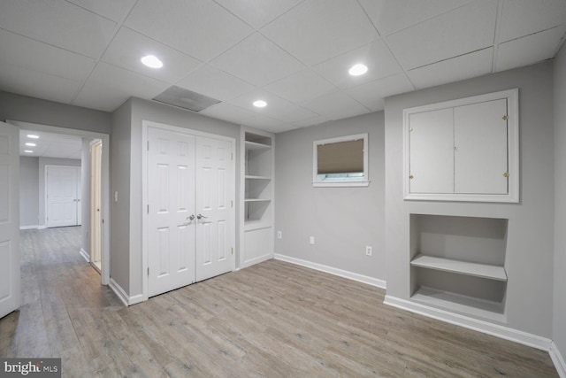 553 Choptank Cove Ct, Annapolis, MD 21401 - basement with built in shelves, wood finished floors, and recessed lighting
