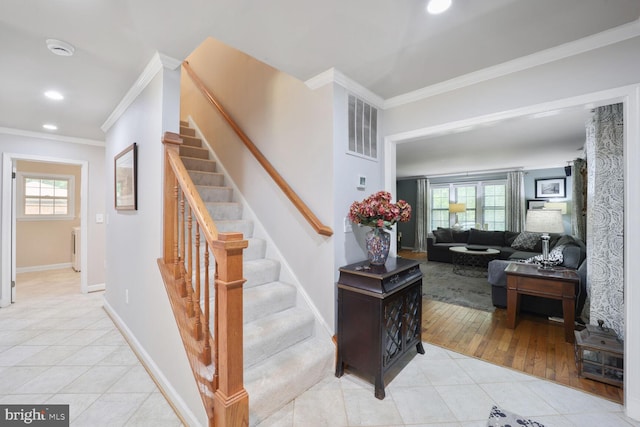 553 Choptank Cove Ct, Annapolis, MD 21401 - stairway featuring tile patterned floors, crown molding, and recessed lighting