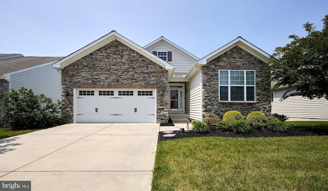 722 Cherry Tree Rd, Middletown, DE 19709 - traditional-style house with stone siding, concrete driveway, an attached garage, and a front yard