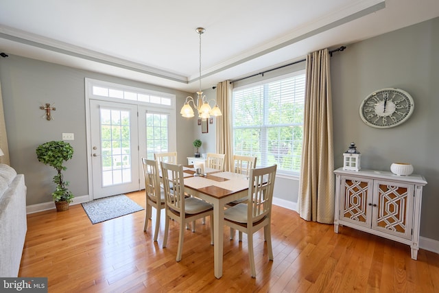 722 Cherry Tree Rd, Middletown, DE 19709 - dining area with light wood-style flooring, plenty of natural light, a chandelier, and a tray ceiling