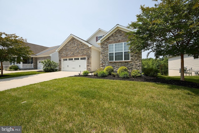 722 Cherry Tree Rd, Middletown, DE 19709 - view of front of property with stone siding, a garage, a front lawn, and driveway