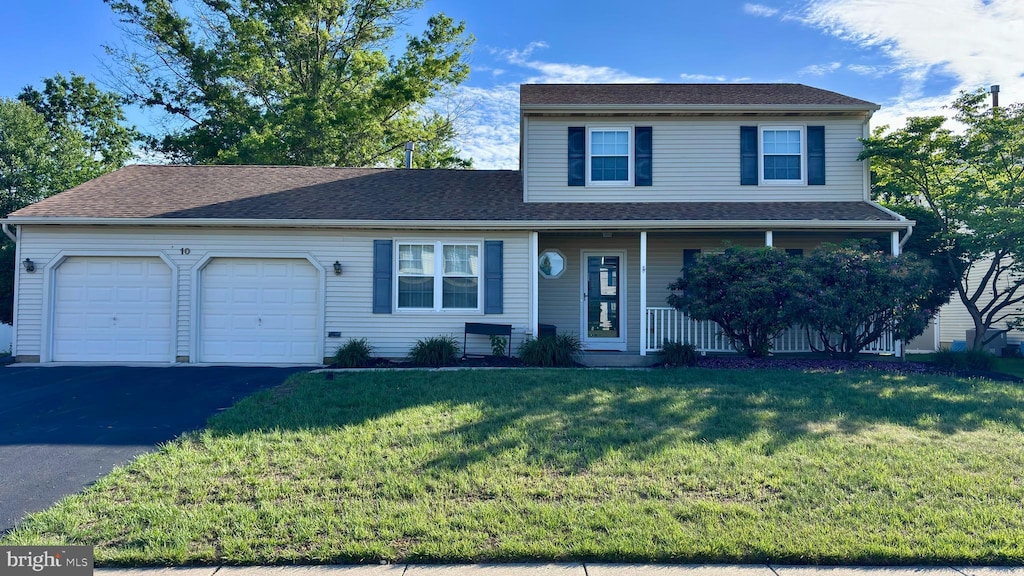 10 Berwick Ln, Sicklerville, NJ 08081 - view of front facade with a garage, driveway, a front yard, and covered porch