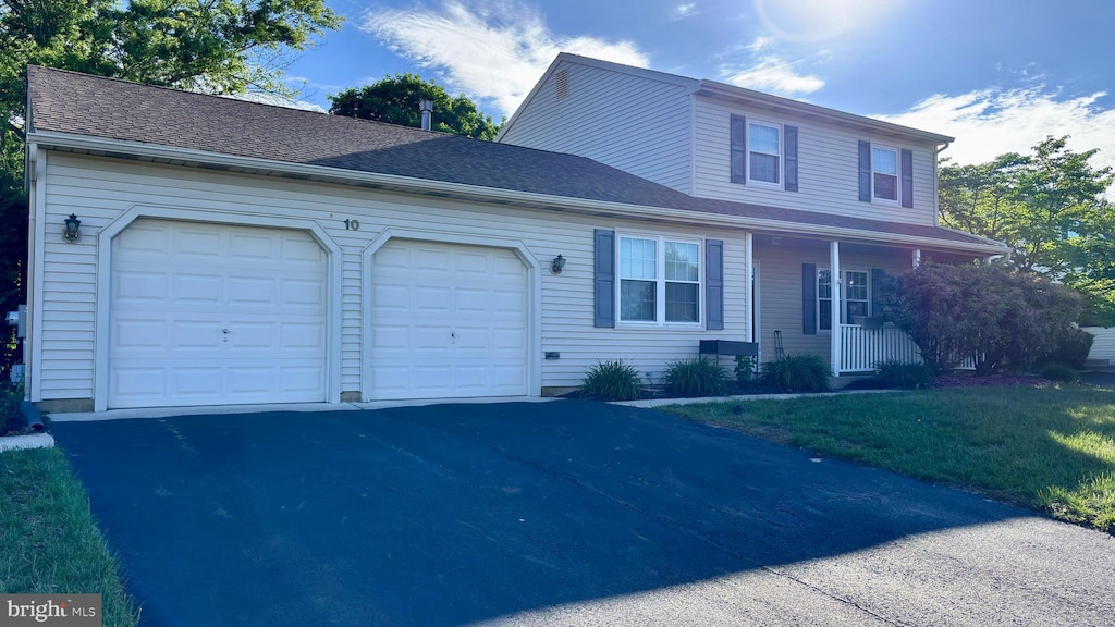 10 Berwick Ln, Sicklerville, NJ 08081 - view of front facade featuring an attached garage, asphalt driveway, and covered porch