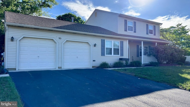 10 Berwick Ln, Sicklerville, NJ 08081 - view of front facade featuring an attached garage, asphalt driveway, and covered porch