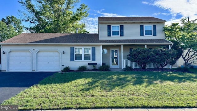 10 Berwick Ln, Sicklerville, NJ 08081 - traditional-style home featuring a garage, asphalt driveway, a front yard, and covered porch