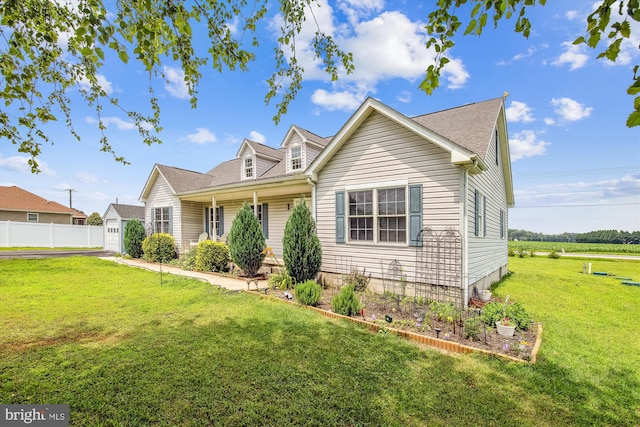32105 Judiths Ln, Frankford, DE 19945 - cape cod house featuring a front yard and driveway