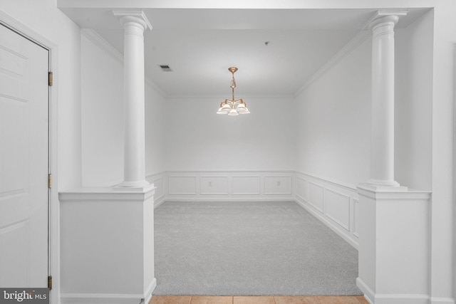 9713 Handerson Pl Unit 203, Manassas Park, VA 20111 - unfurnished dining area with crown molding, light colored carpet, decorative columns, and wainscoting