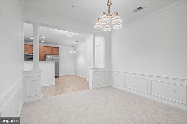 9713 Handerson Pl Unit 203, Manassas Park, VA 20111 - kitchen with appliances with stainless steel finishes, ornate columns, brown cabinets, light carpet, and crown molding