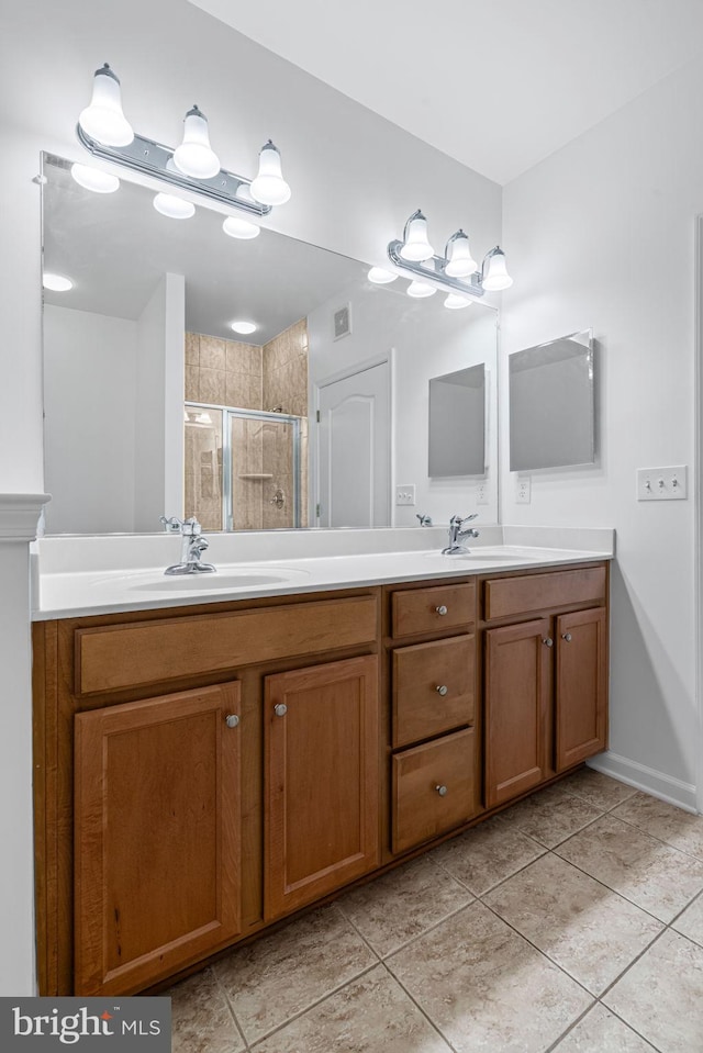9713 Handerson Pl Unit 203, Manassas Park, VA 20111 - bathroom with double vanity, a stall shower, and tile patterned flooring