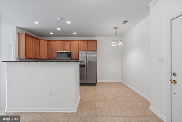 9713 Handerson Pl Unit 203, Manassas Park, VA 20111 - kitchen featuring appliances with stainless steel finishes, dark countertops, recessed lighting, brown cabinets, and a peninsula