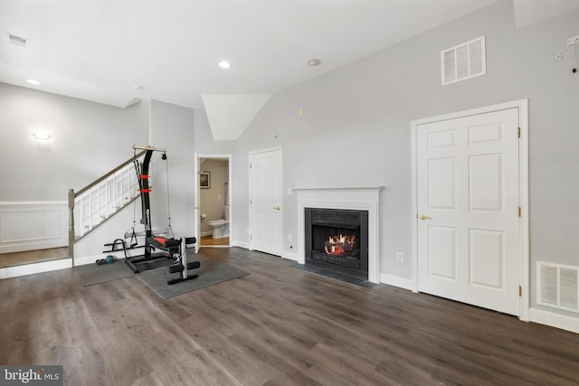 2517 Hunton Pl, Alexandria, VA 22311 - workout area featuring wood finished floors, a fireplace with flush hearth, lofted ceiling, and recessed lighting