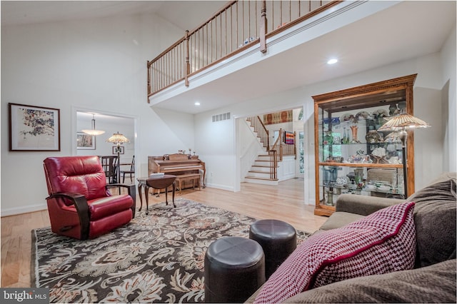 310 Belmont Ct, Lincoln University, PA 19352 - living room with stairs, wood finished floors, and a towering ceiling