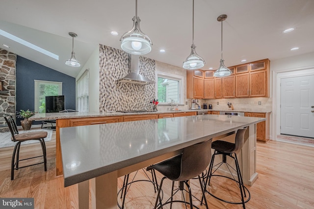 310 Belmont Ct, Lincoln University, PA 19352 - kitchen featuring wall chimney exhaust hood, light wood-style floors, decorative backsplash, a kitchen bar, and recessed lighting