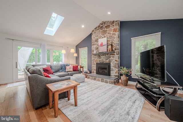 310 Belmont Ct, Lincoln University, PA 19352 - living area with a skylight, vaulted ceiling, a fireplace, and light wood-style flooring