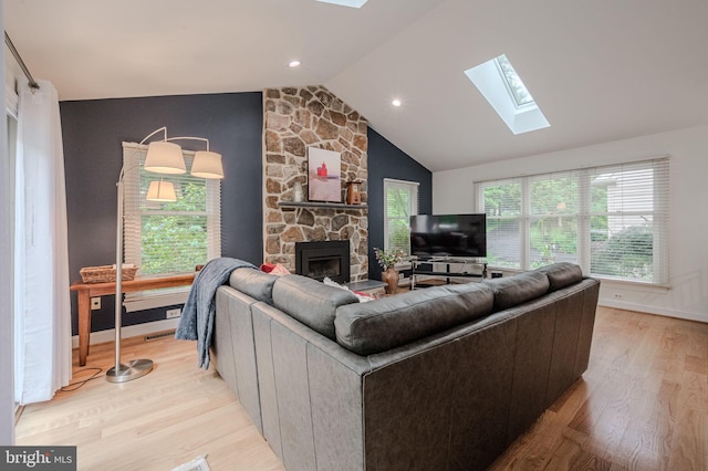 310 Belmont Ct, Lincoln University, PA 19352 - living room with a skylight, a fireplace, vaulted ceiling, light wood-style flooring, and recessed lighting
