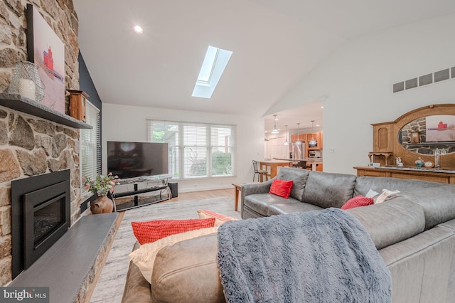 310 Belmont Ct, Lincoln University, PA 19352 - living room with a skylight, wood finished floors, a fireplace, and high vaulted ceiling