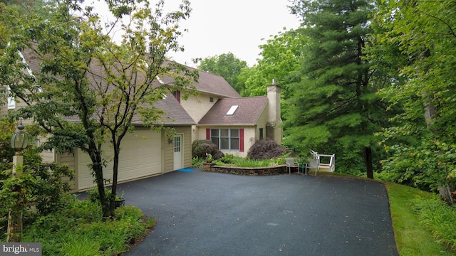 310 Belmont Ct, Lincoln University, PA 19352 - view of front of property with driveway, a garage, a chimney, and roof with shingles