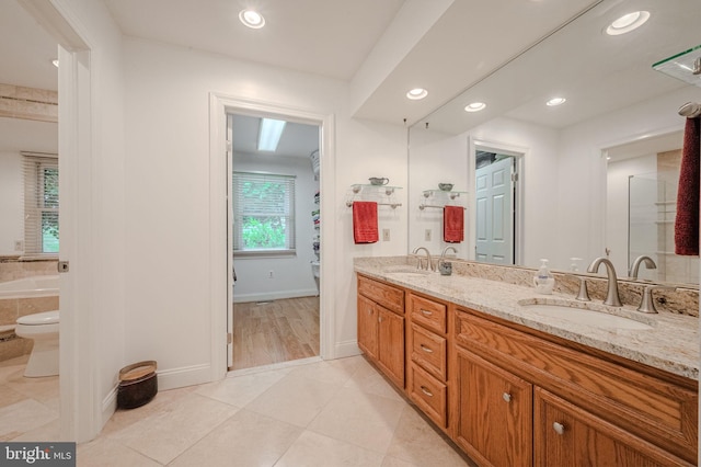 310 Belmont Ct, Lincoln University, PA 19352 - bathroom with double vanity, a tub to relax in, recessed lighting, and tile patterned flooring