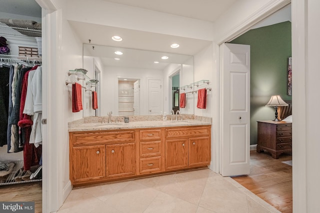 310 Belmont Ct, Lincoln University, PA 19352 - bathroom featuring double vanity, recessed lighting, a walk in closet, and tile patterned floors