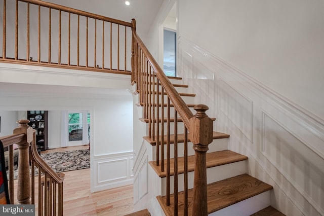 310 Belmont Ct, Lincoln University, PA 19352 - stairs featuring a decorative wall, wood finished floors, and a wainscoted wall