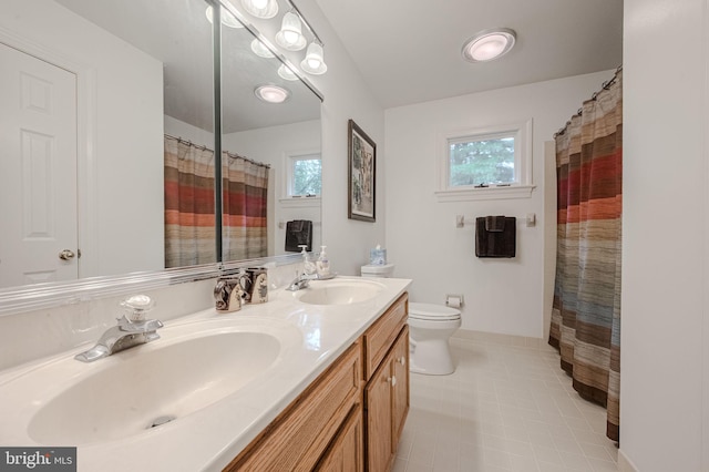 310 Belmont Ct, Lincoln University, PA 19352 - full bath featuring double vanity, curtained shower, and tile patterned flooring