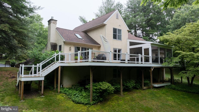 310 Belmont Ct, Lincoln University, PA 19352 - rear view of house featuring a sunroom, a wooden deck, a chimney, stucco siding, and a shingled roof