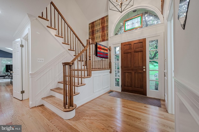 310 Belmont Ct, Lincoln University, PA 19352 - foyer with a decorative wall, wood finished floors, stairs, a chandelier, and a towering ceiling