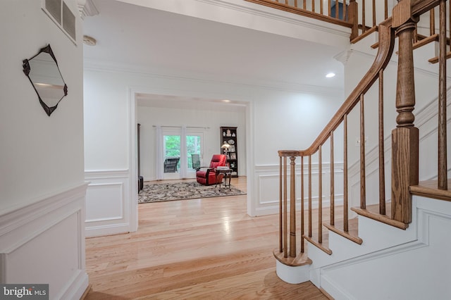 310 Belmont Ct, Lincoln University, PA 19352 - entryway featuring a decorative wall, stairway, light wood-style flooring, crown molding, and a wainscoted wall