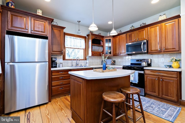902 Station Ave, Haddon Heights, NJ 08035 - kitchen featuring stainless steel appliances, light wood-style flooring, light countertops, a center island, and recessed lighting