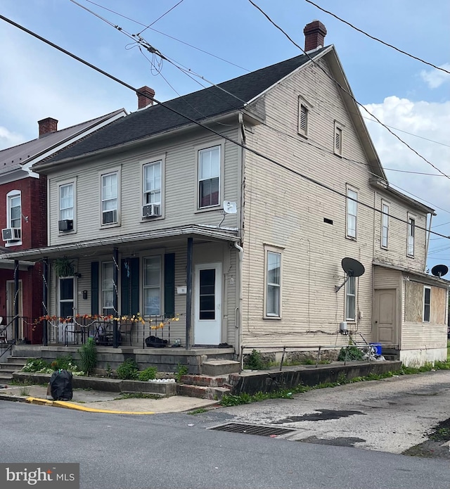 208 S Spruce St, Lewistown, PA 17044 - view of property featuring covered porch and a chimney