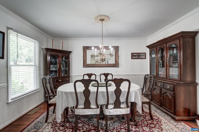 1505 Running Deer Dr, Keswick, VA 22947 - dining area featuring a chandelier, wood finished floors, and crown molding