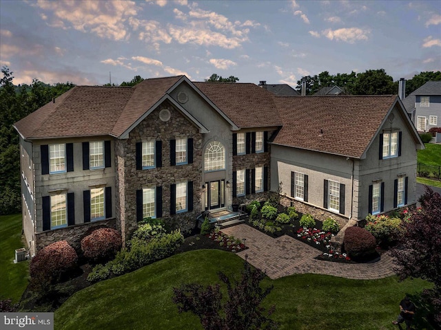 22 Thomas Speakman Dr Unit 76, Glen Mills, PA 19342 - colonial-style house featuring stone siding, a front lawn, and stucco siding