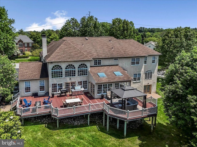 22 Thomas Speakman Dr Unit 76, Glen Mills, PA 19342 - back of house with a gazebo, a wooden deck, a chimney, and an outdoor hangout area