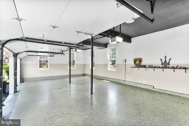 22 Thomas Speakman Dr Unit 76, Glen Mills, PA 19342 - garage featuring baseboards and a garage door opener