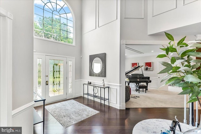 22 Thomas Speakman Dr Unit 76, Glen Mills, PA 19342 - entryway featuring crown molding, wood finished floors, a wainscoted wall, a high ceiling, and a decorative wall