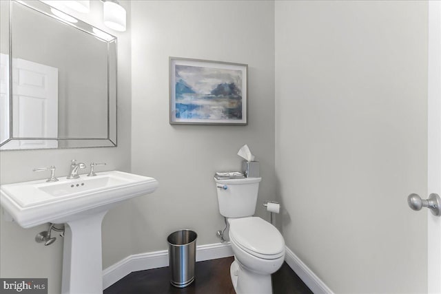 22 Thomas Speakman Dr Unit 76, Glen Mills, PA 19342 - half bath with baseboards and wood finished floors
