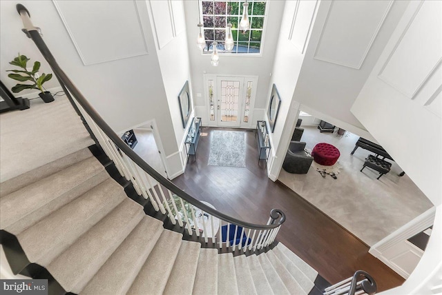 22 Thomas Speakman Dr Unit 76, Glen Mills, PA 19342 - staircase featuring wood finished floors and a towering ceiling