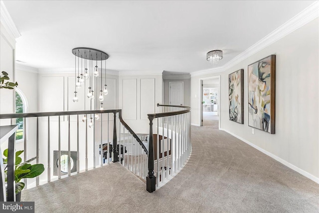 22 Thomas Speakman Dr Unit 76, Glen Mills, PA 19342 - hallway with an upstairs landing, a chandelier, ornamental molding, and carpet