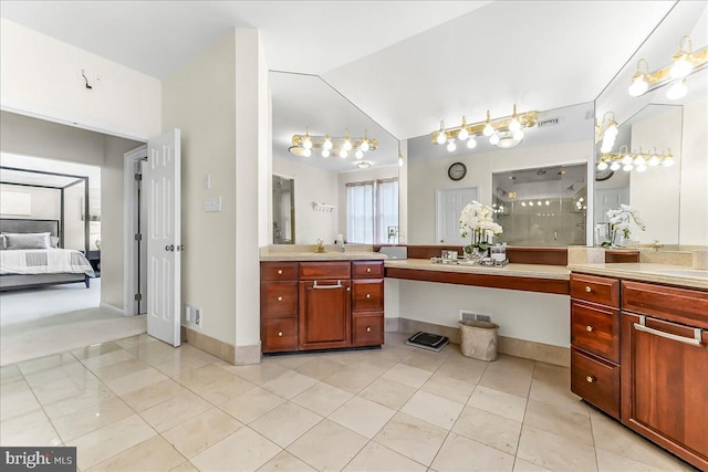 22 Thomas Speakman Dr Unit 76, Glen Mills, PA 19342 - ensuite bathroom featuring vanity, vaulted ceiling, a stall shower, and tile patterned floors