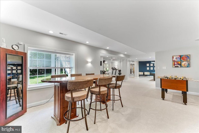 22 Thomas Speakman Dr Unit 76, Glen Mills, PA 19342 - dining space with light carpet, bar, and recessed lighting