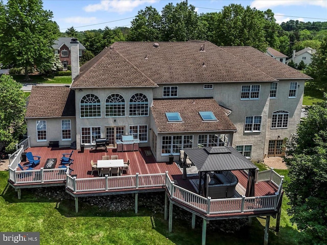 22 Thomas Speakman Dr Unit 76, Glen Mills, PA 19342 - back of house with a gazebo, stucco siding, a wooden deck, a chimney, and outdoor dining space